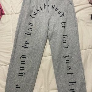 grey jogger sweatpants with gothic lettering